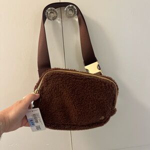 lululemon brown sherpa belt bag with gold hardware